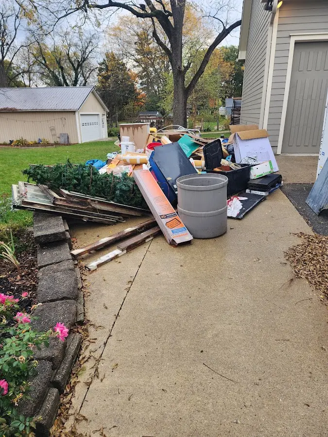 Dumpster being loaded with debris for Commercial Dumpster Rental in Spotswood